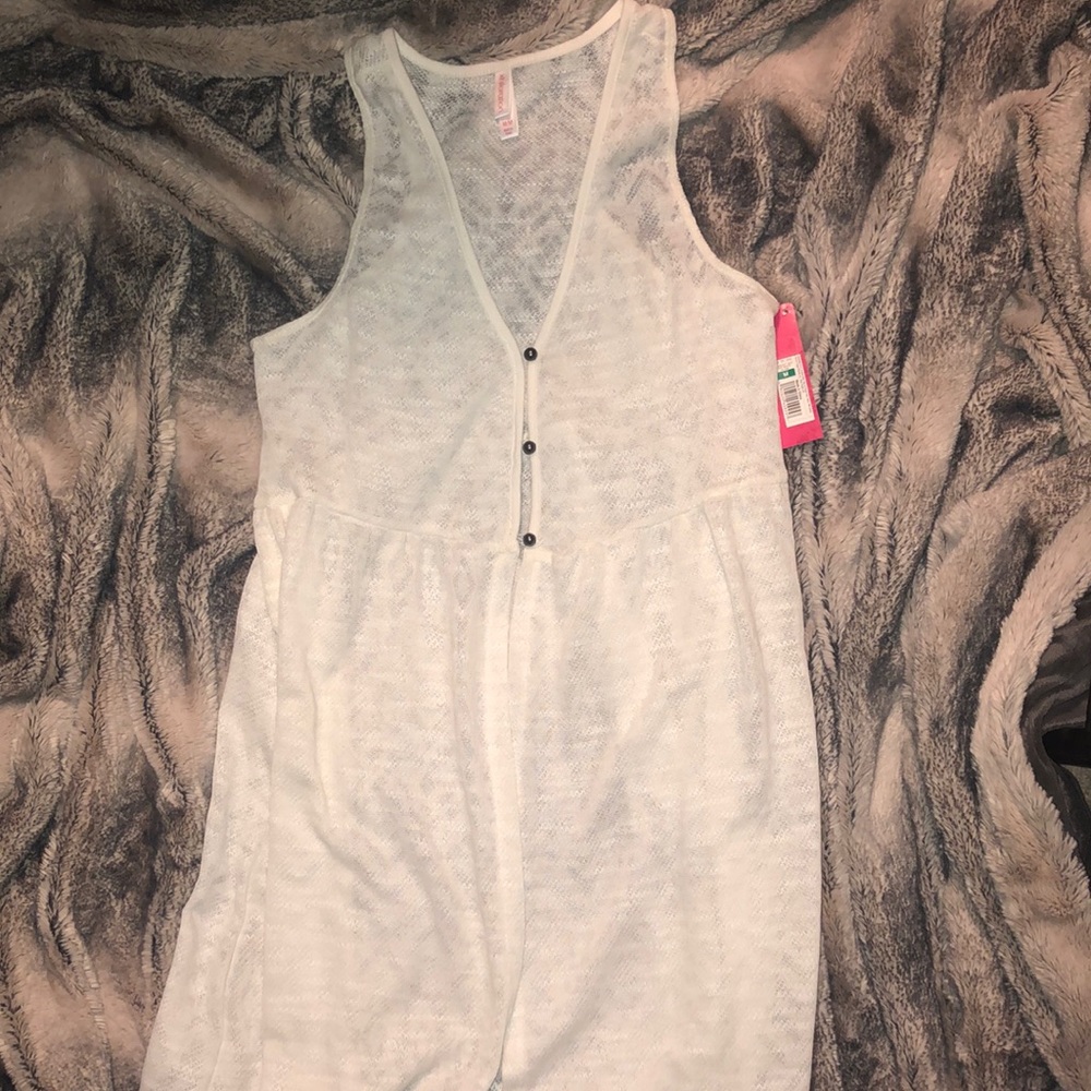 *Cream Colored Sleeveless Cardigan*